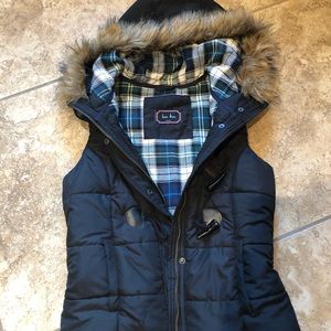 black puffy vest with hood